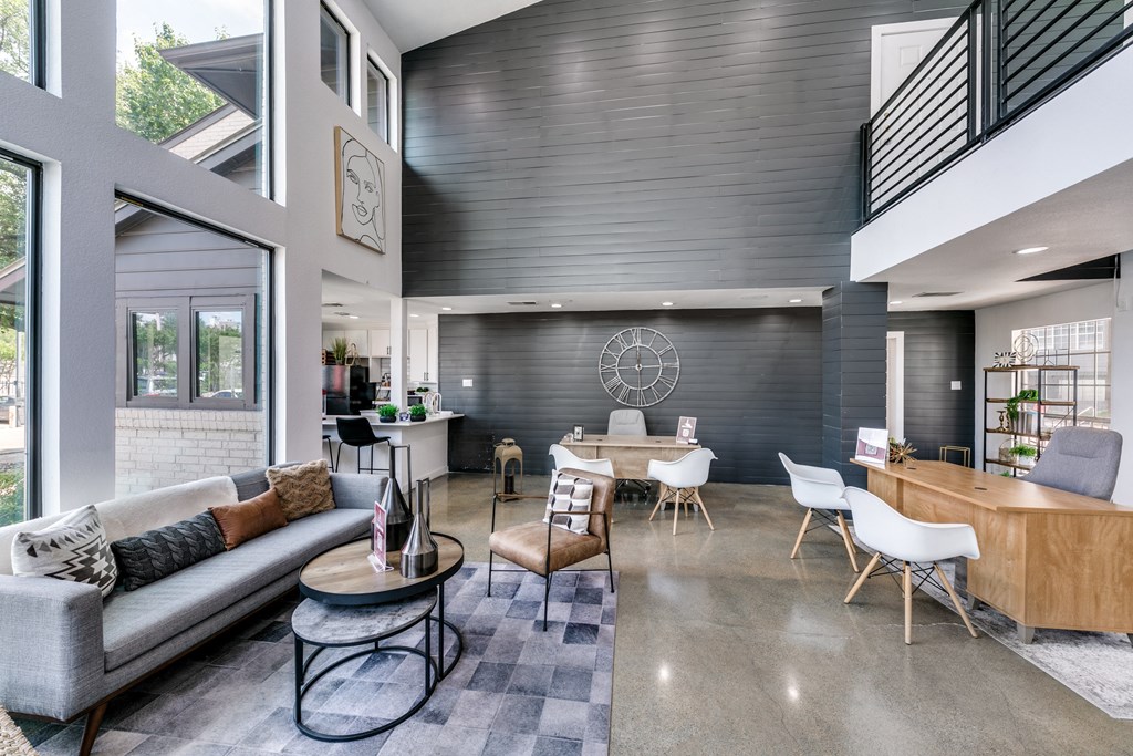 a living room with a couch and a table with chairs