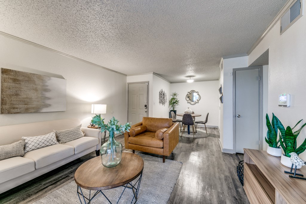 a living room with a couch and a chair and a table