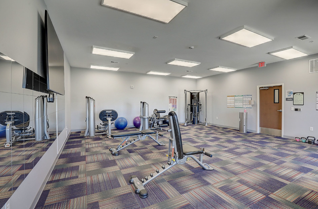 our state of the art fitness room is equipped with cardio machines and weights