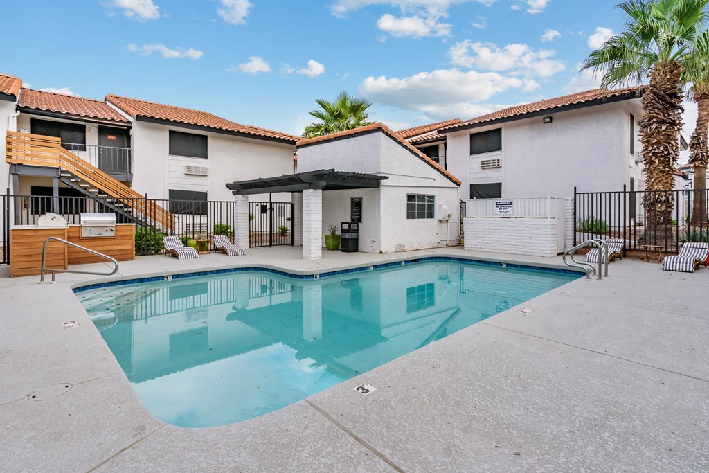 the pool at the whispering winds apartments in pearland, tx