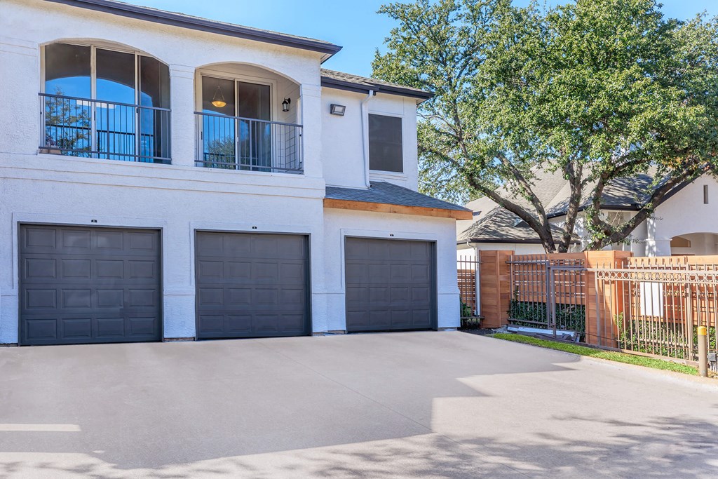 a house with a garage with three garage doors
