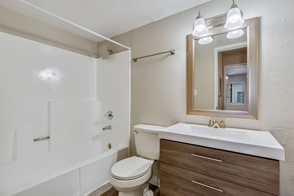 a bathroom with a toilet sink and bathtub