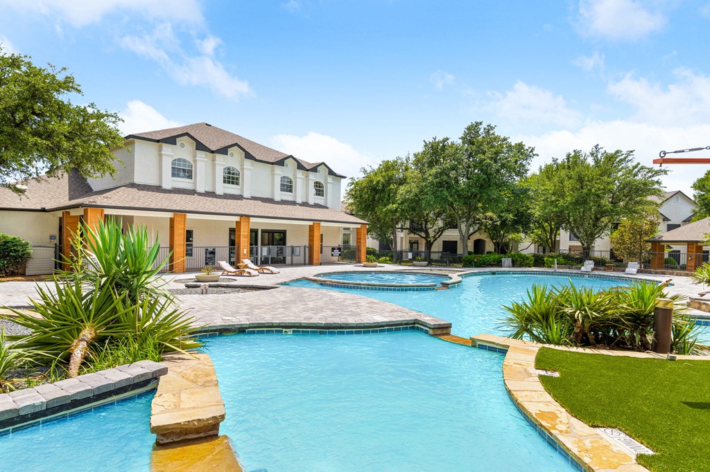 a house with a swimming pool in front of it