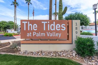 a sign for the tides at palm valley