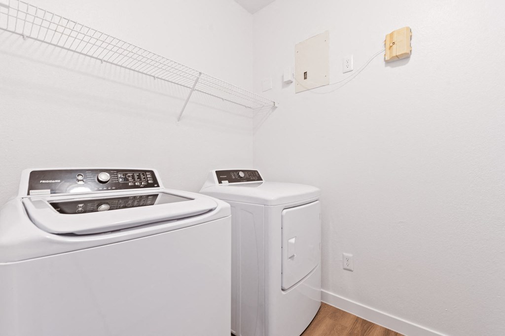 a laundry room with a washer and dryer