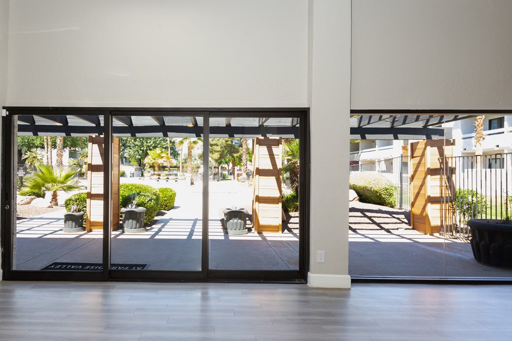 a view of the entrance to a building with glass doors
