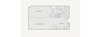 A floor plan of a small apartment with a bedroom, living room, kitchen, and bathroom.