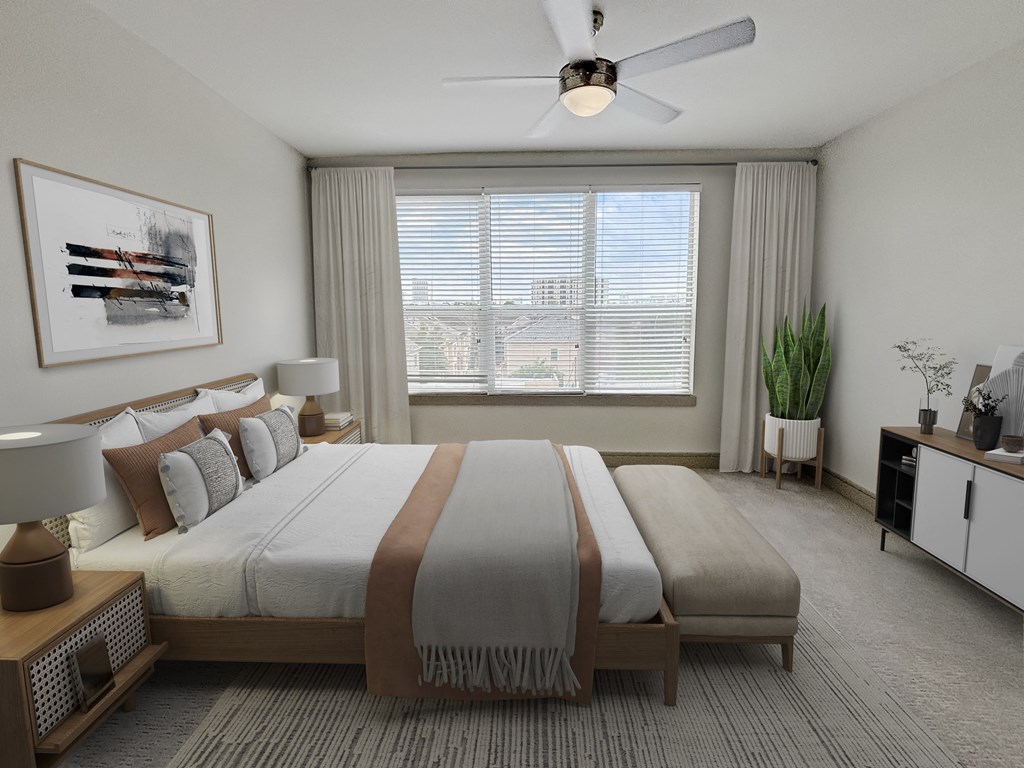 a bedroom with two beds and a ceiling fan