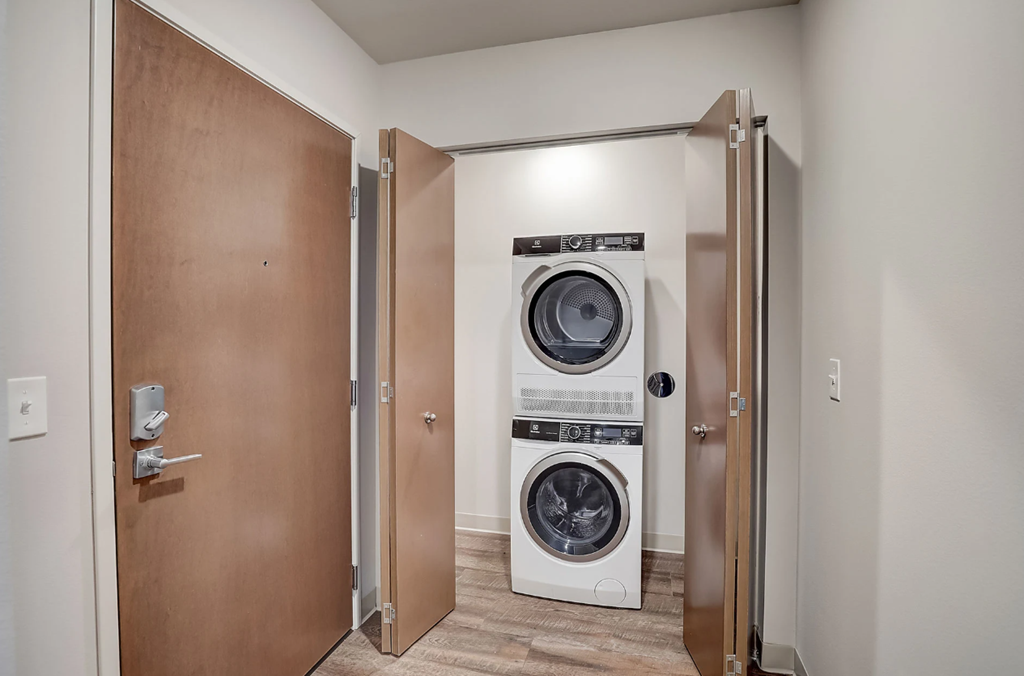 a small laundry room with a washing machine and a dryer