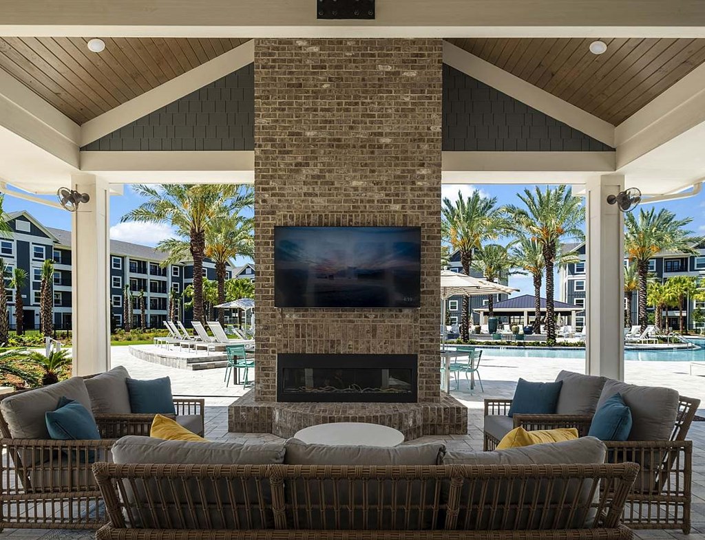 a living room with a fireplace and a pool