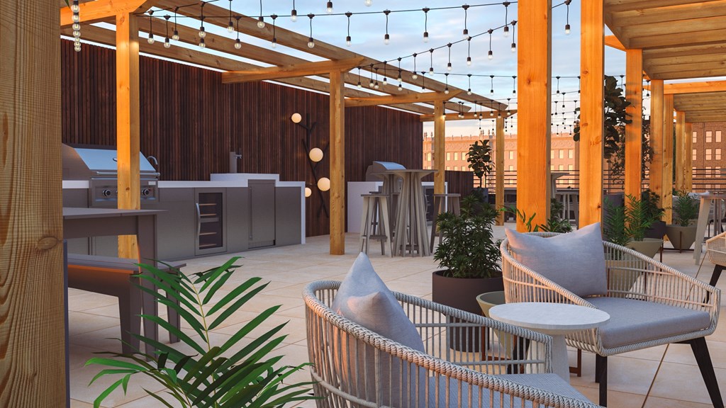 A patio with a table and chairs and a plant.