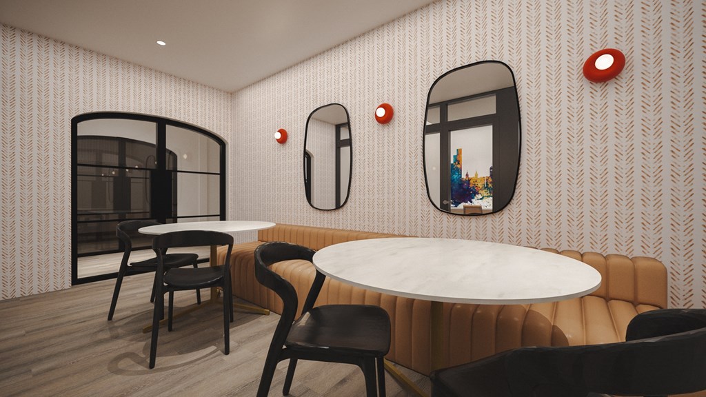 A modern dining area with a round table and chairs.