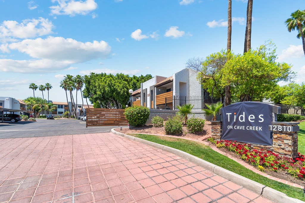 a home with a sign that says tides of one creek in front of it