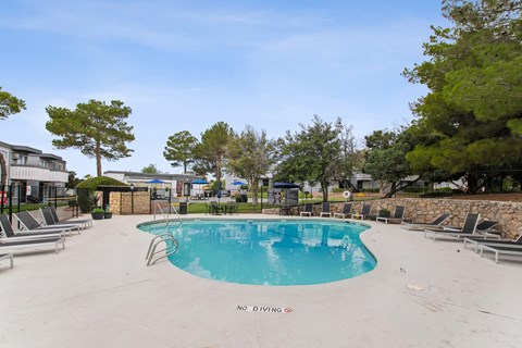 A pool with a no diving sign in the middle.