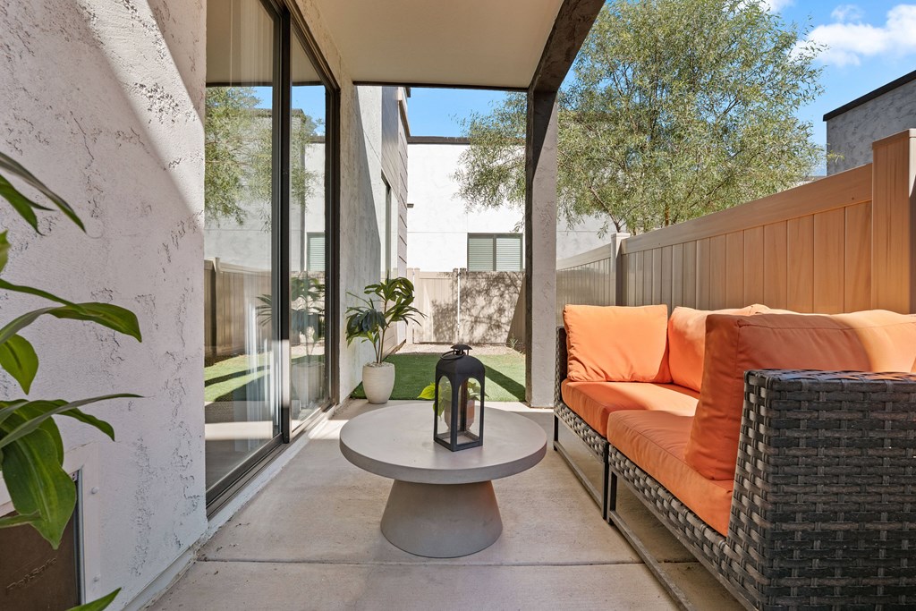 a patio with a couch and a table