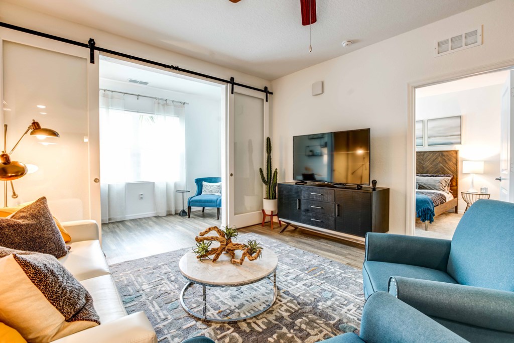 a living room with a couch and a tv