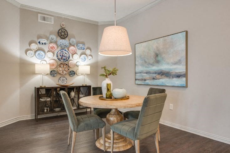 a dining room with a table and chairs