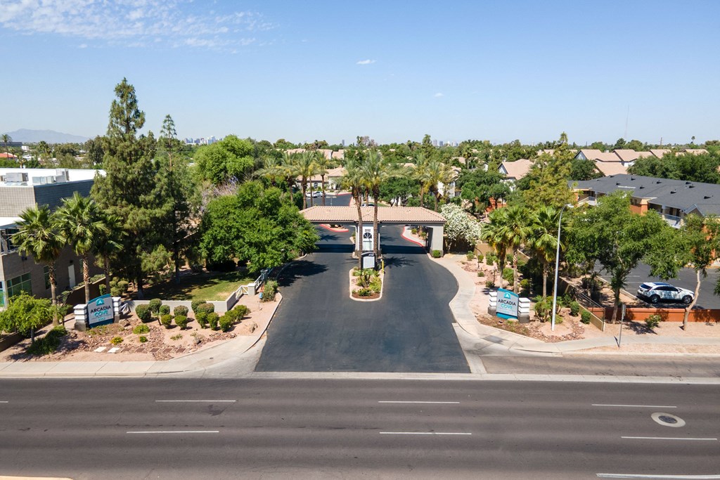 an aerial view of a neighborhood with a street and houses