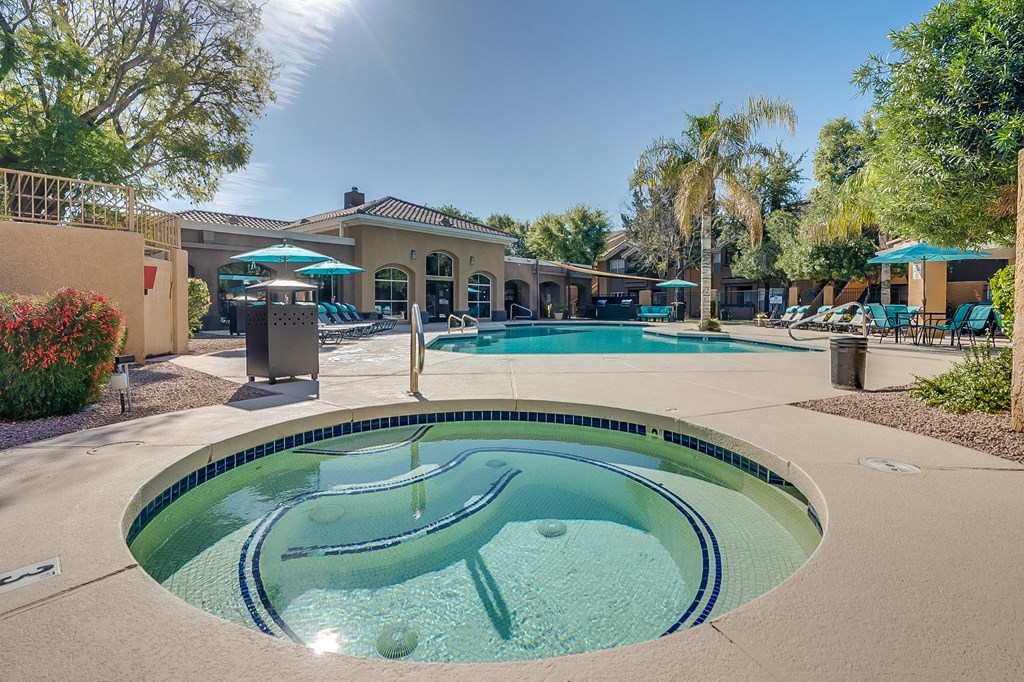 take a dip in the hot tub at villas at houston levee west apartments in