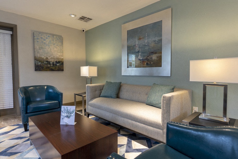 a living room filled with furniture and a large window