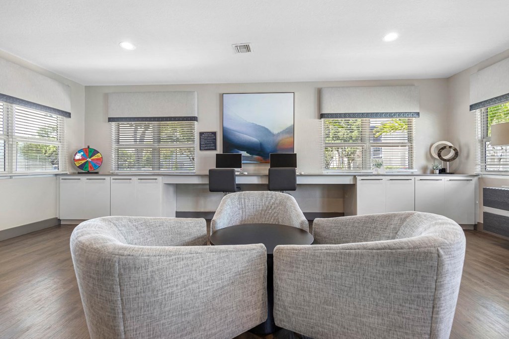 a living room with two chairs and a table