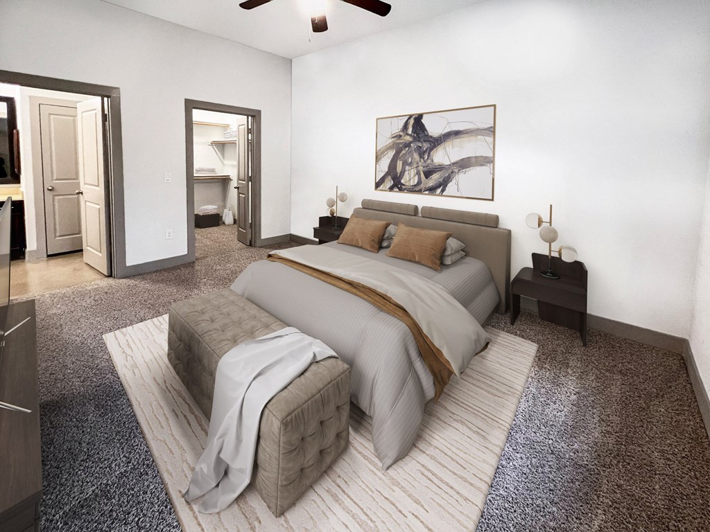 a bedroom with white walls and gray carpet