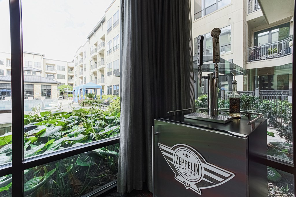 a view of the city from a hotel window with a vending machine