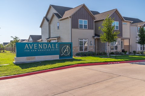 the estates at avendale sign in front of a house