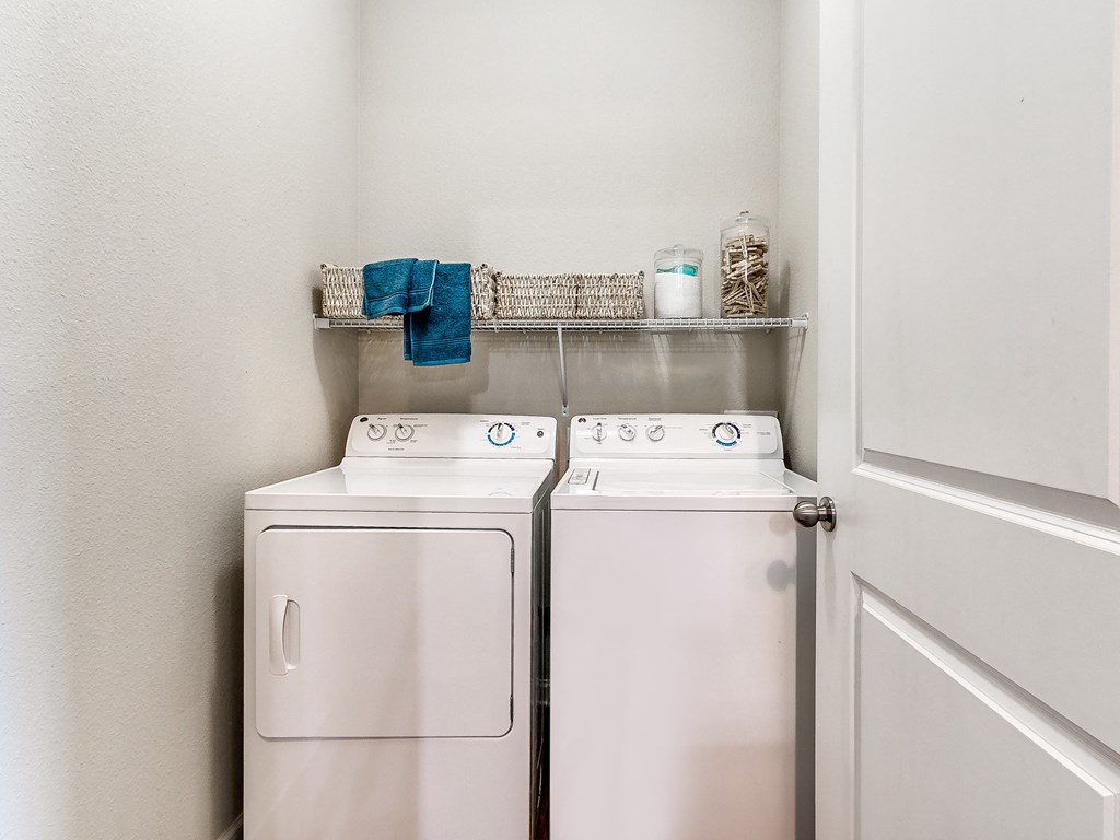 a small laundry room with a washer and dryer