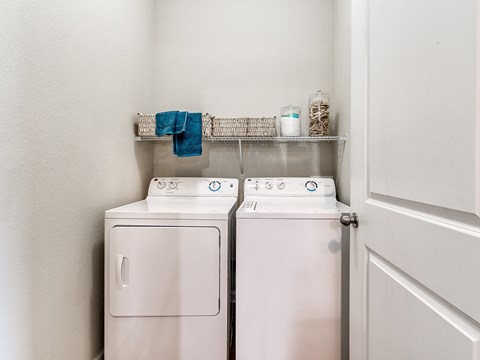 a small laundry room with a washer and dryer