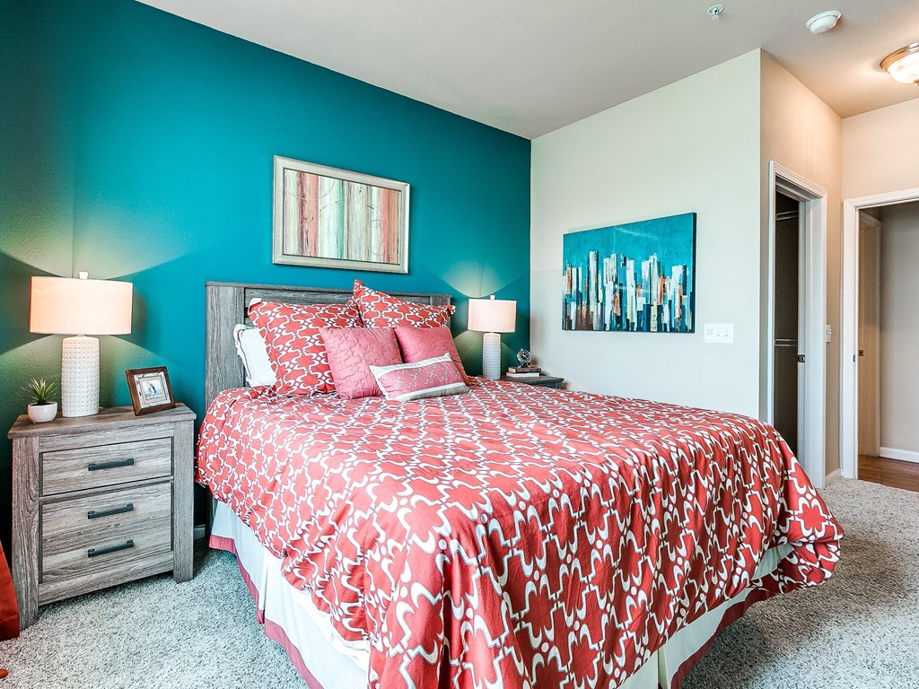 a bedroom with a bed and two night stands