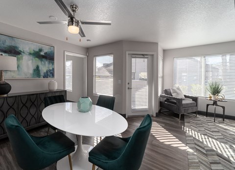 a living room with a white table and chairs