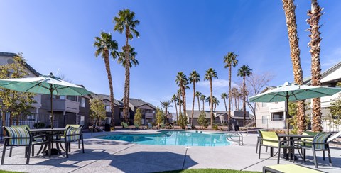 our apartments have a swimming pool and tables with umbrellas