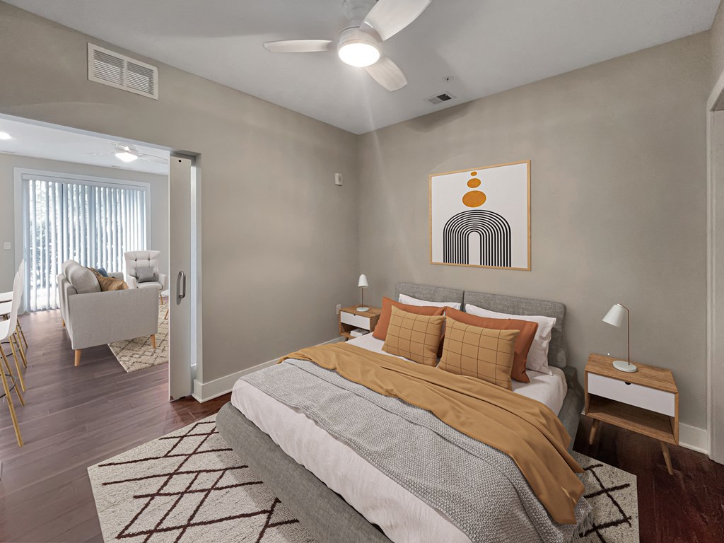a bedroom with a bed and a ceiling fan
