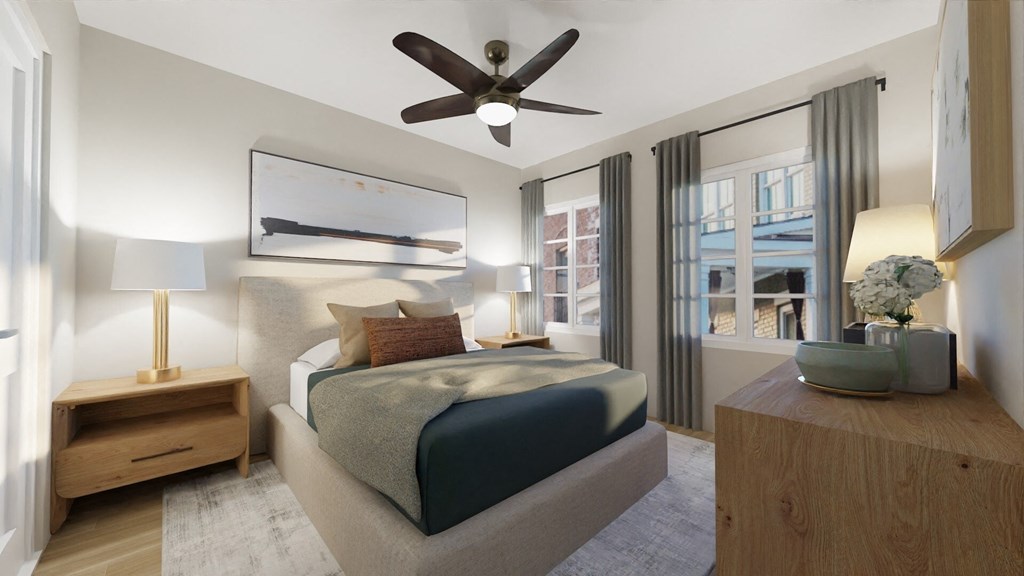 a bedroom with a bed and a ceiling fan