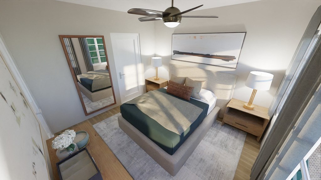 an overhead view of a bedroom with a bed and a ceiling fan