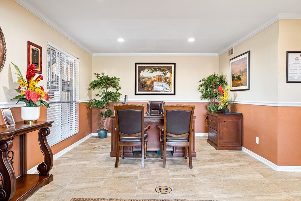 a dining room with a table and chairs
