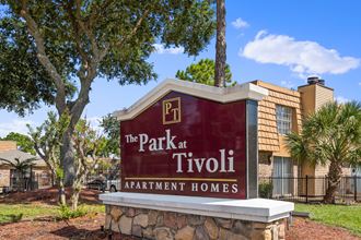 a sign for the park at tivoli apartment homes