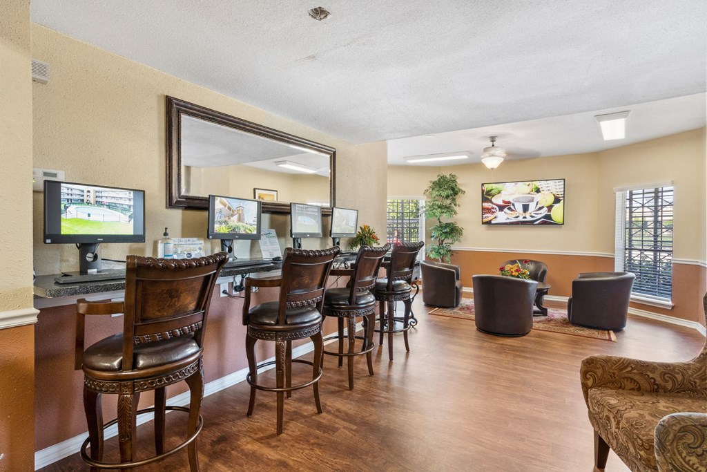 a living room filled with furniture and a flat screen tv