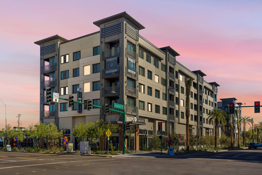 A large building with a balcony on the second floor.