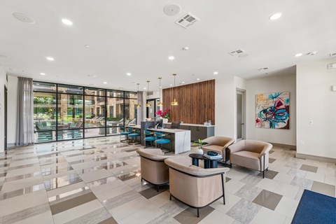 A spacious lobby with a reception desk and comfortable seating.