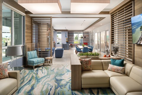 A living room with a couch, chairs, and a rug.