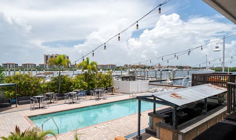 A pool area with a view of the city.