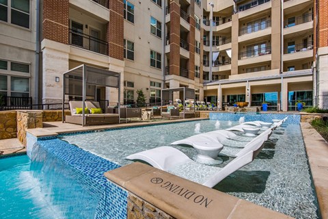 A swimming pool with the word "OPERATION" on the edge.