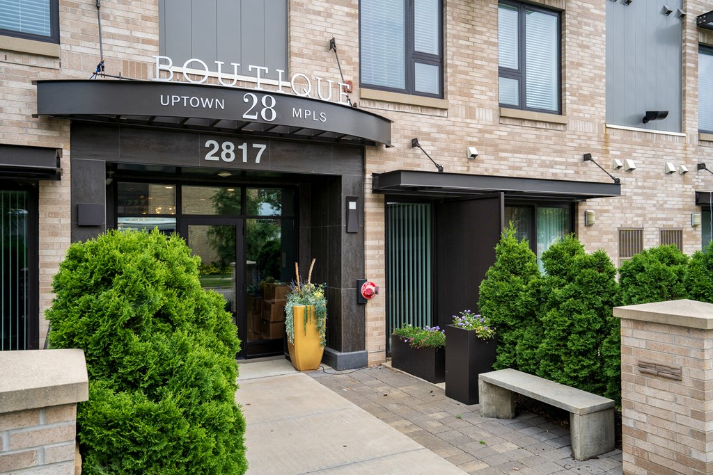the front of a building with a door and a sign that reads 308
