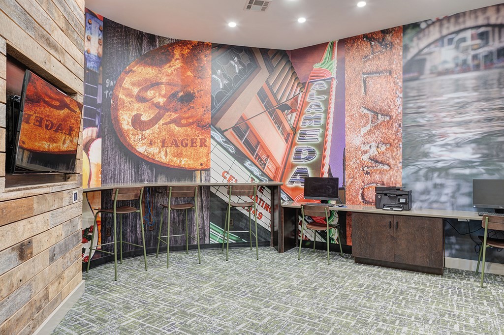 A room with a wooden wall and a mural of a beer sign.