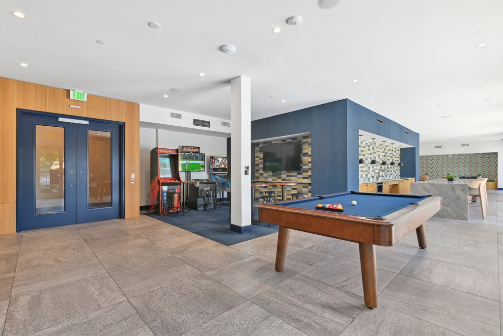 play a game of pool in our games room at our apartments