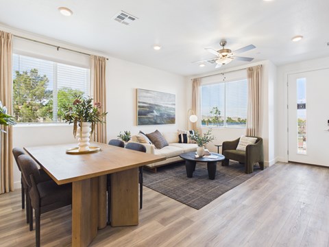 A modern living room with a dining table and a couch.