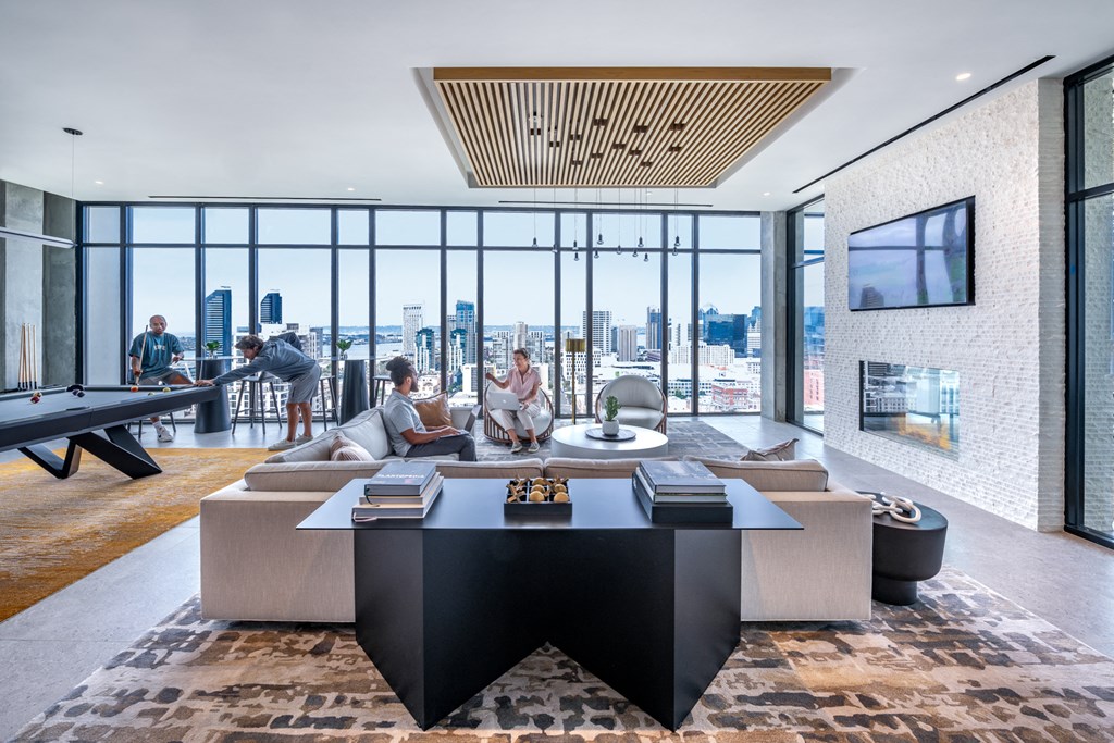 a living room with a couch and a table and a large window