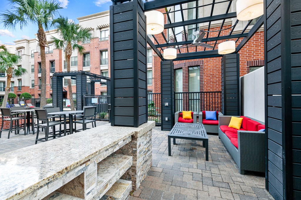 a patio with furniture and a table